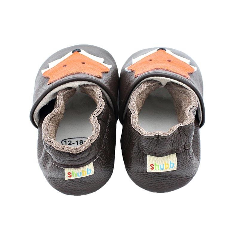 Tofflor av Fox Head läder